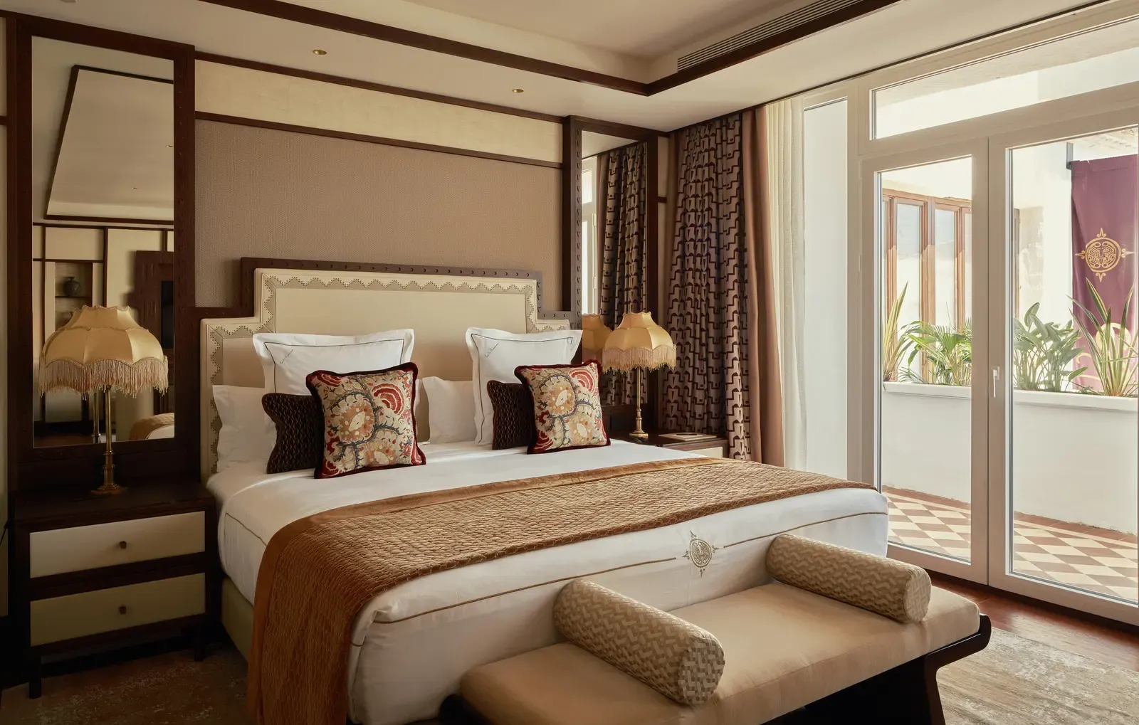 The bedroom of the COYA Suite Marbella with a super-king bed and doors to the terrace