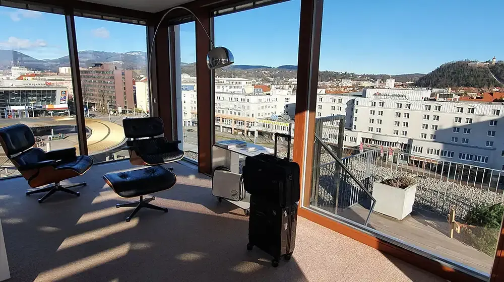 Lounge chairs in the LoftCube with a view over Graz