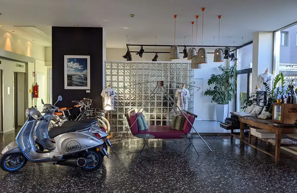 Vespa scooters for hire in the lobby of Hotel Daniel Graz