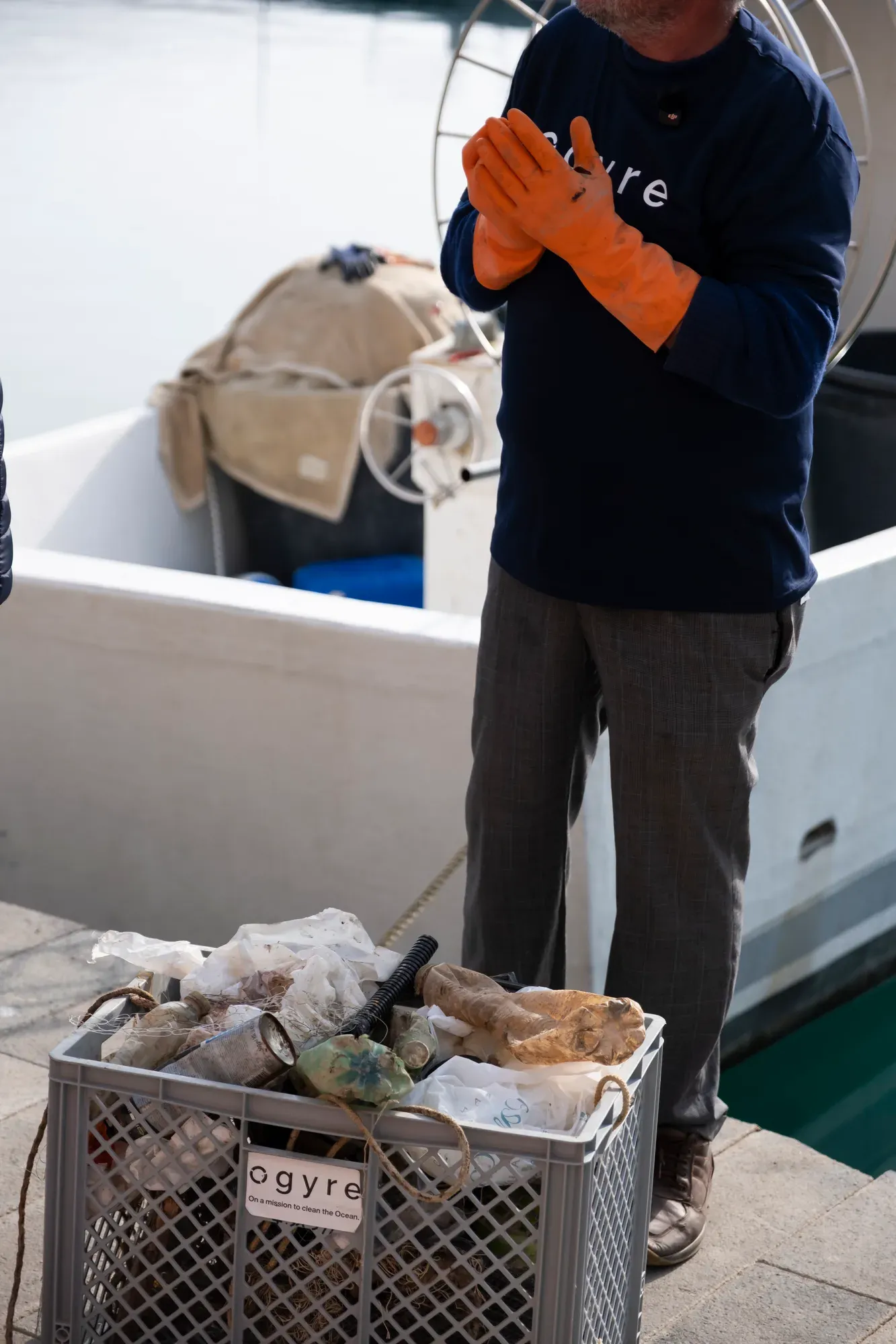 A fisherman with a crate of collected marine litter for the Ogyre programme