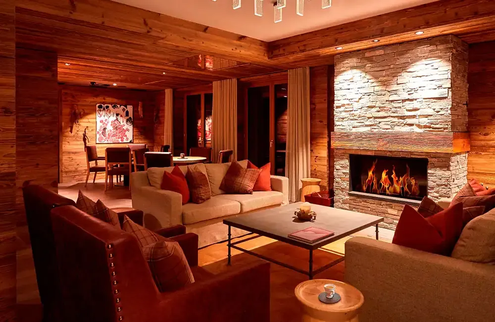 Lounge with open fireplace at The Capra in Saas-Fee