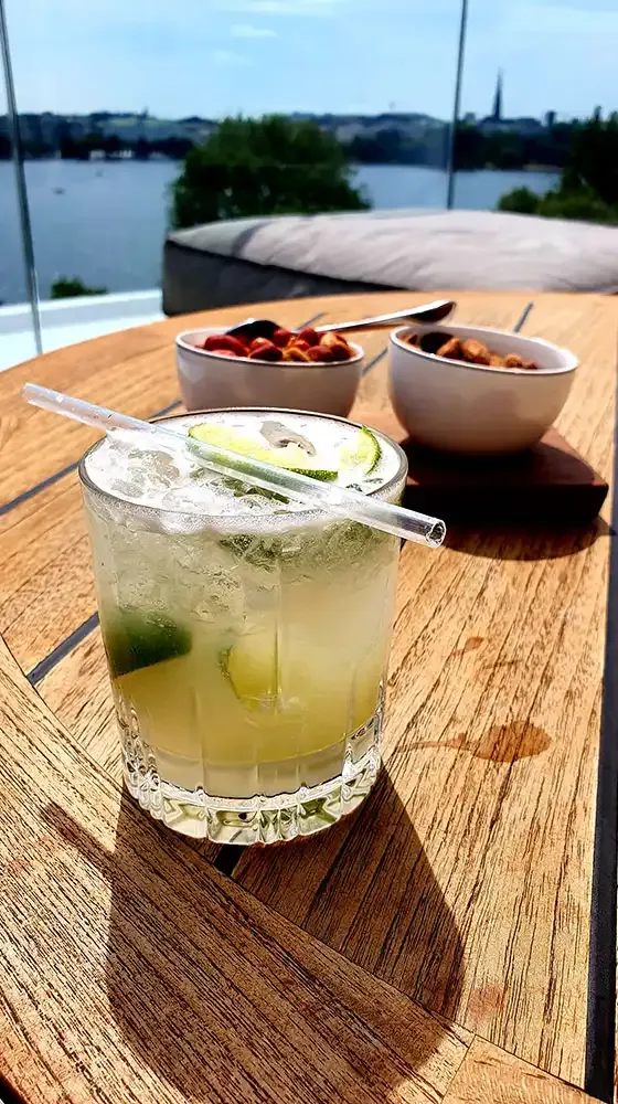 Cocktail on the terrace of The Fontenay Bar overlooking the Alster