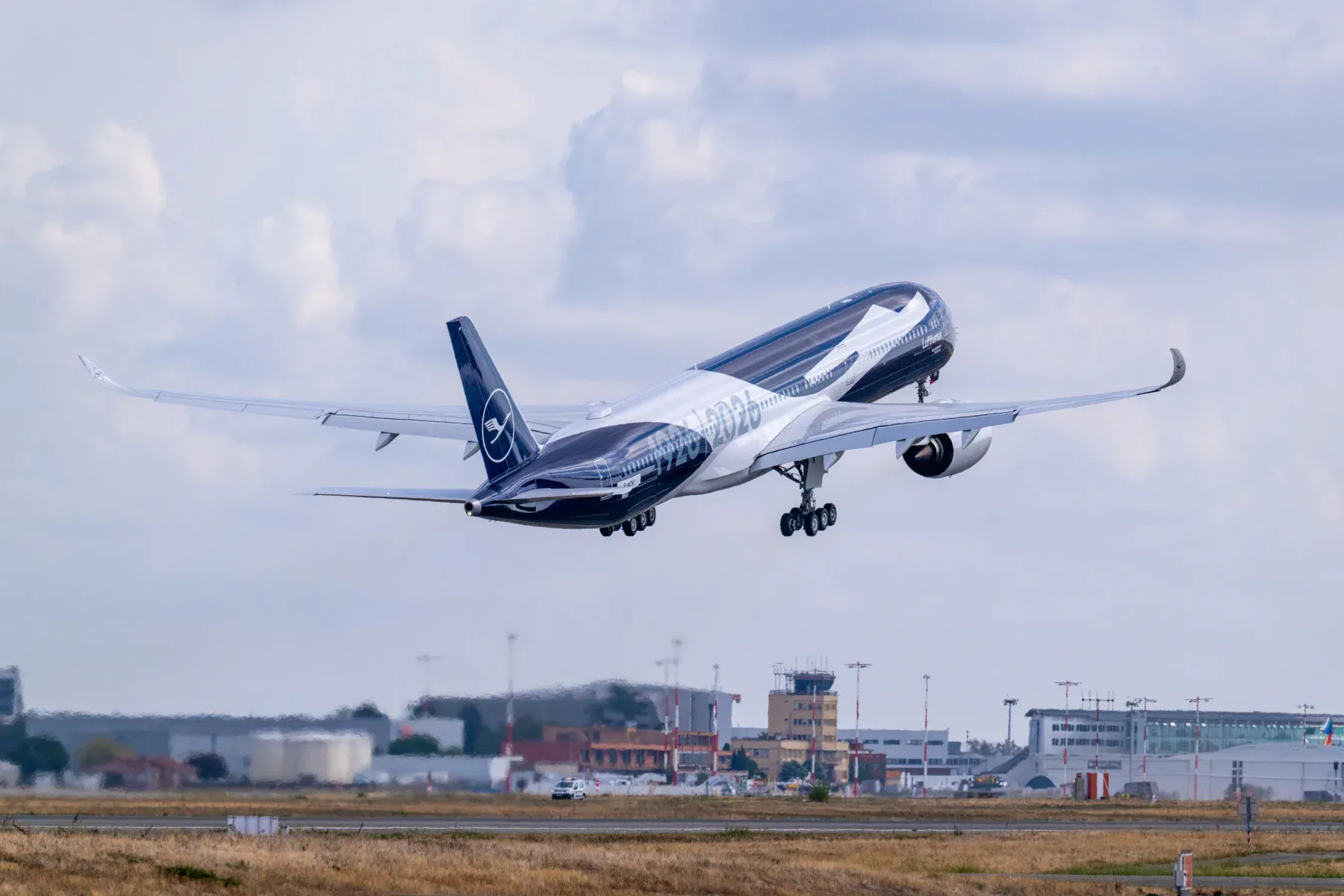 Lufthansa's first Airbus A350-1000 lifting off in Toulouse in the centenary livery