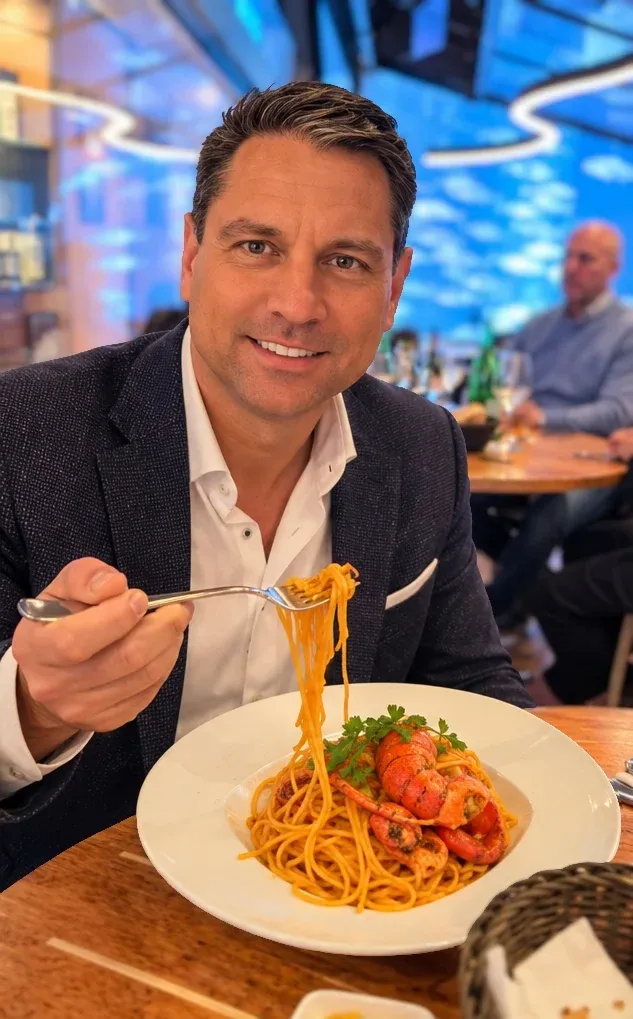 Roger Hohl twirling lobster spaghetti in crustacean sauce at Fisch Witte, Munich