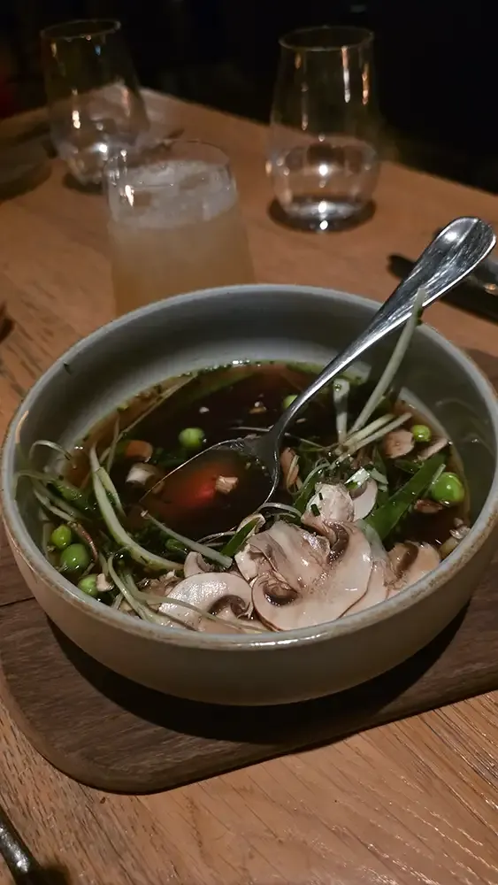 Mushroom consommé, the second course at Hygge Hamburg