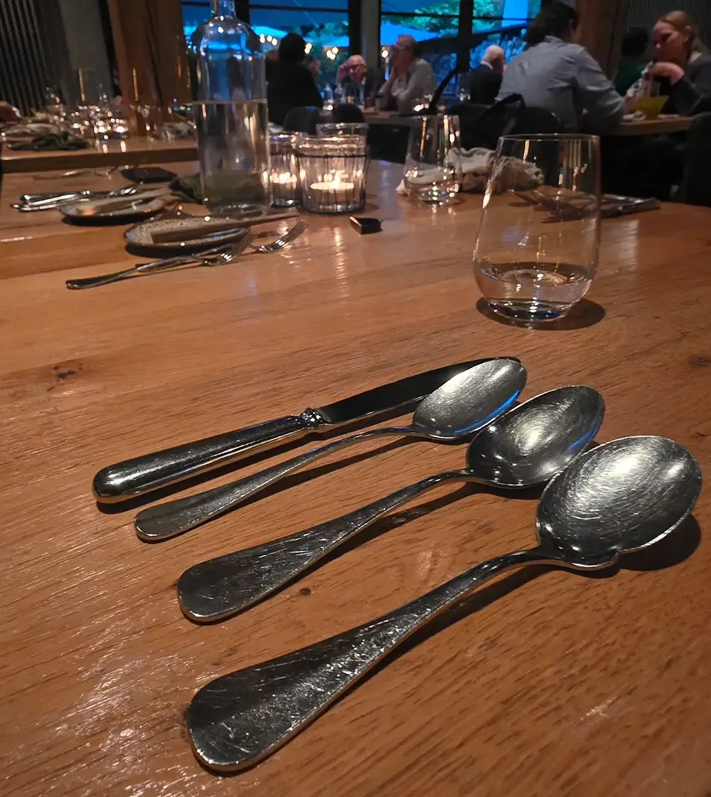 Spoons on the oak table at Hygge Hamburg