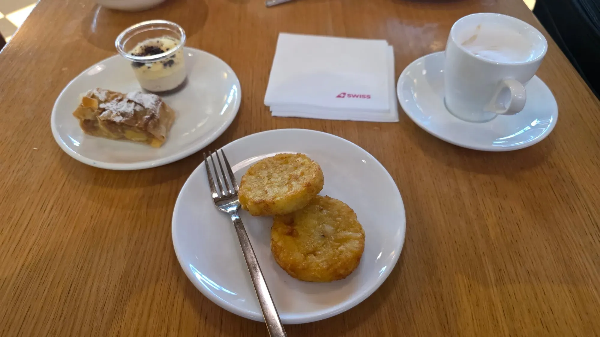 Rösti, apple strudel, a dessert and a coffee in the SWISS Senator Lounge at Zurich Airport