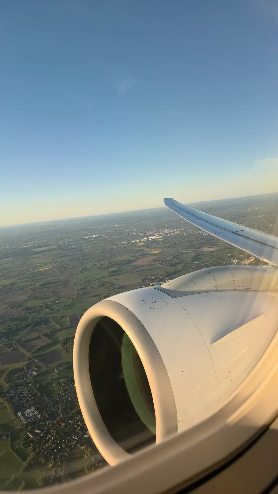 Climbing out of Hamburg over green fields and villages on the Helvetic E195-E2