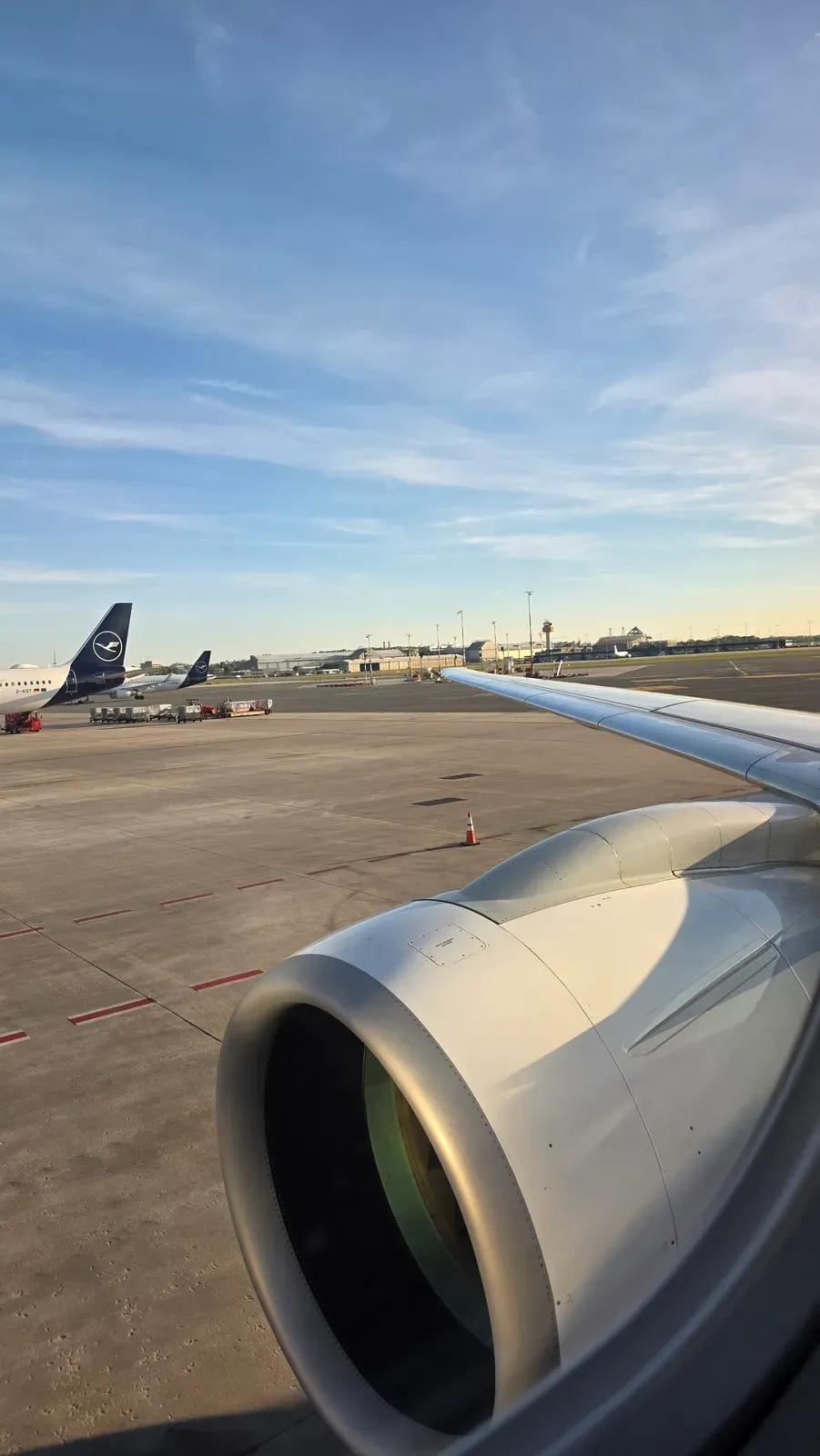The engine of the Helvetic Embraer E195-E2 and Lufthansa aircraft at Hamburg Airport