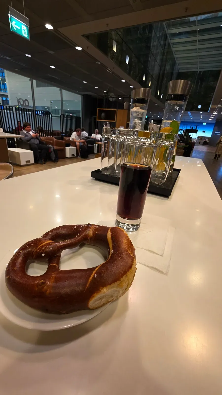 A Bavarian pretzel and a soft drink in the Lufthansa Business Class Lounge at Munich Airport