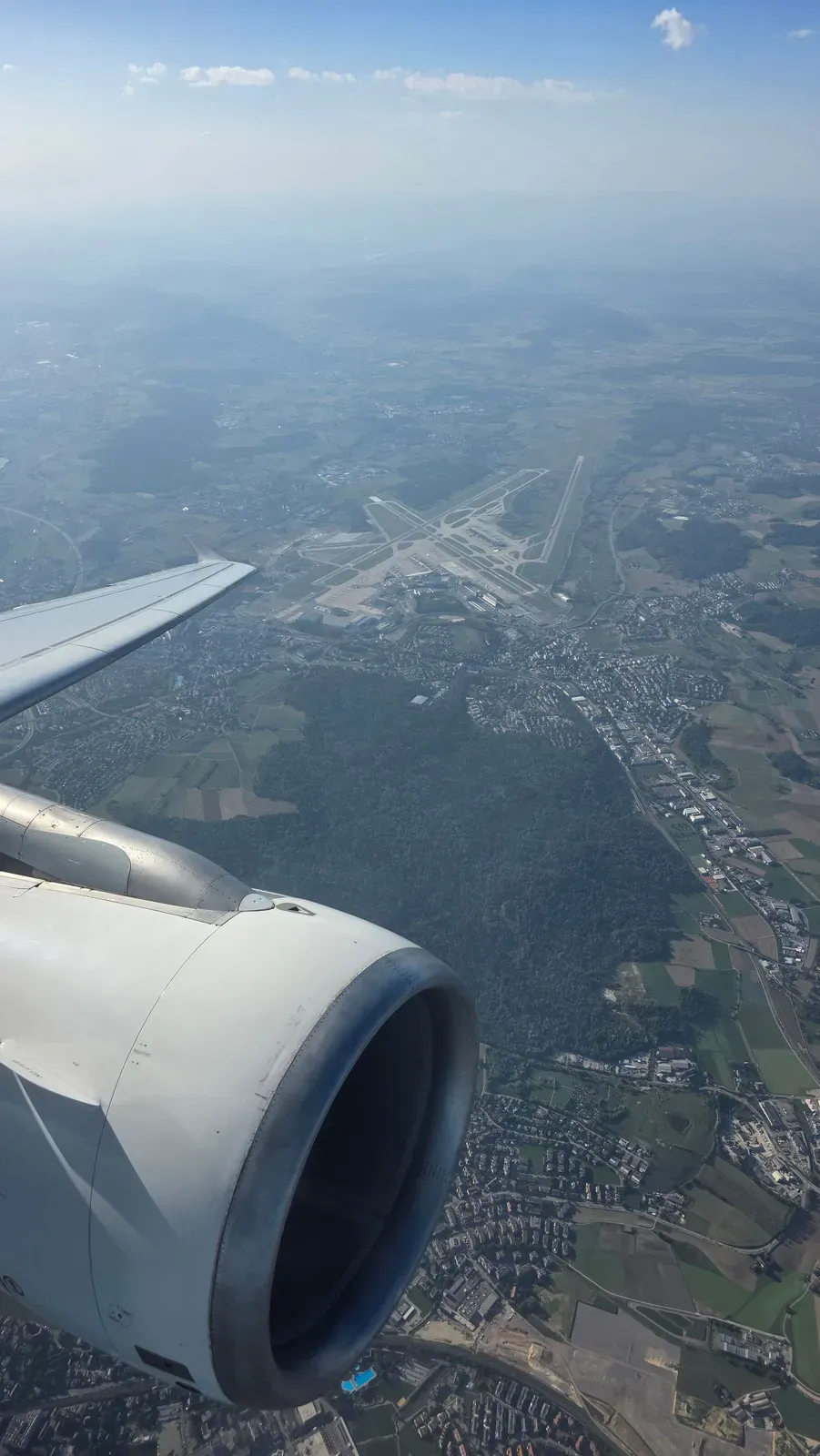 Zurich Airport from above, seen past the engine of the SWISS A320