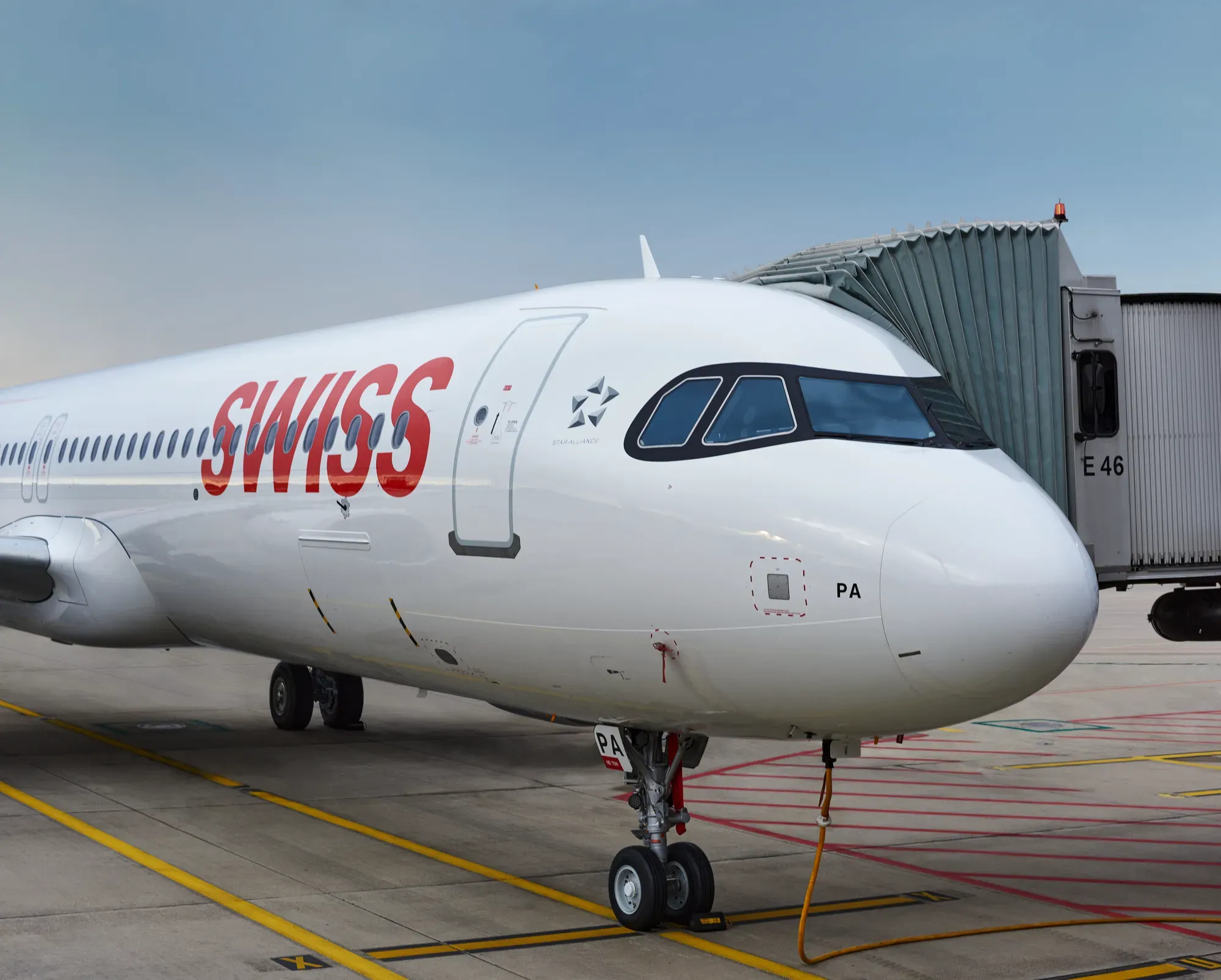 SWISS Airbus A321neo with the registration HB-JPA at the gate