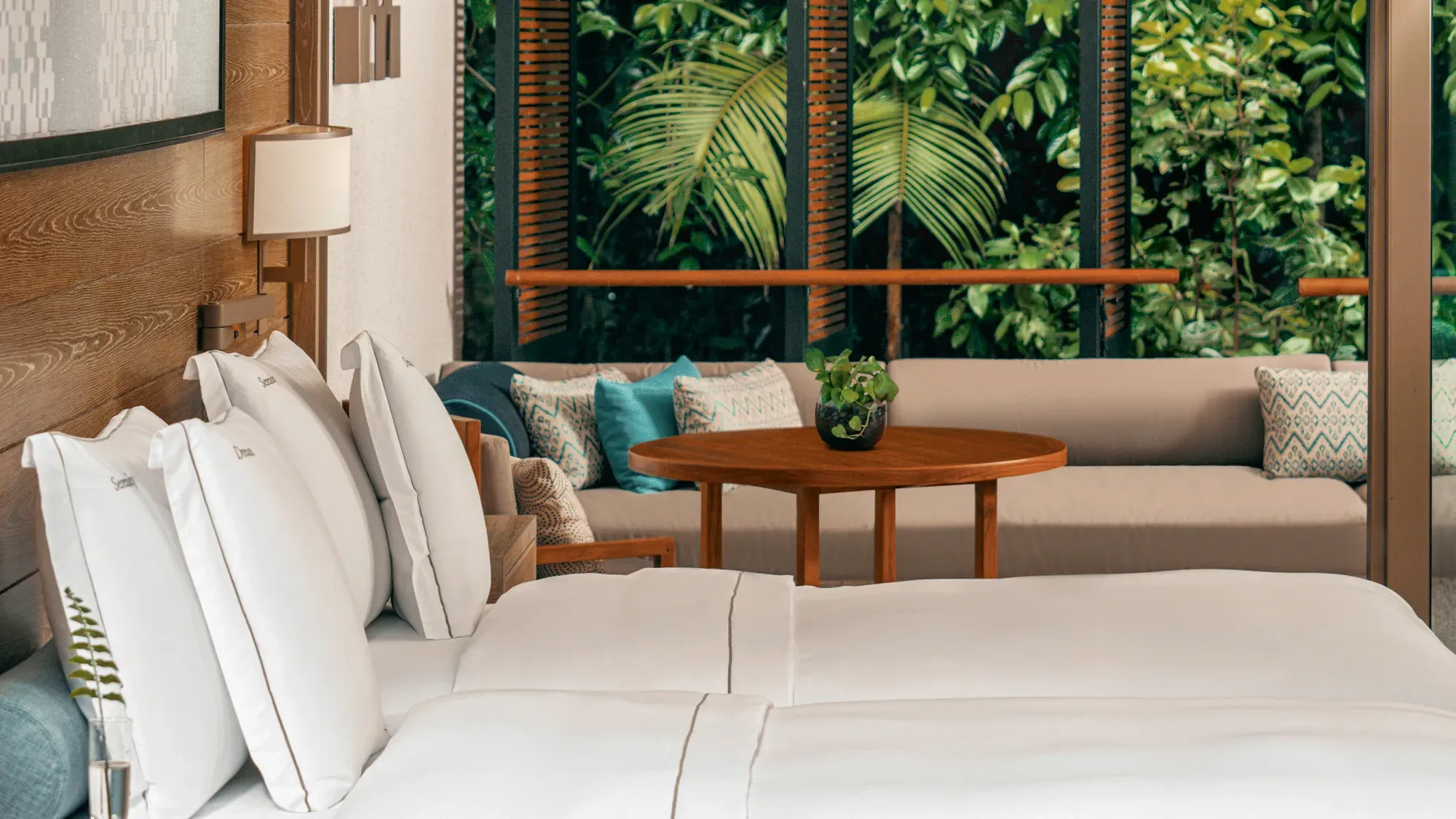 A Rainforest Junior Suite at Mandarin Oriental, Desaru Coast with a view into the trees