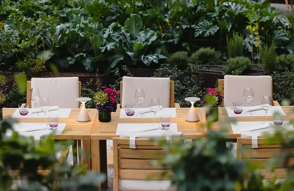 Tables in the garden at Das Blooms