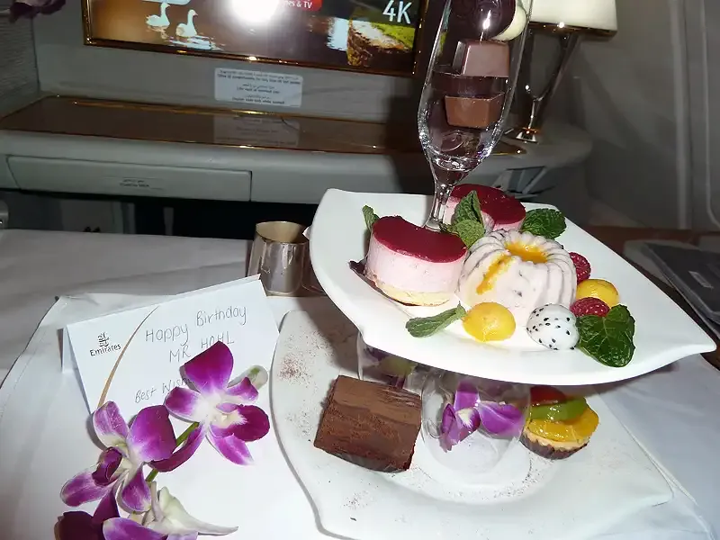 Dessert selection with orchids in Emirates First Class