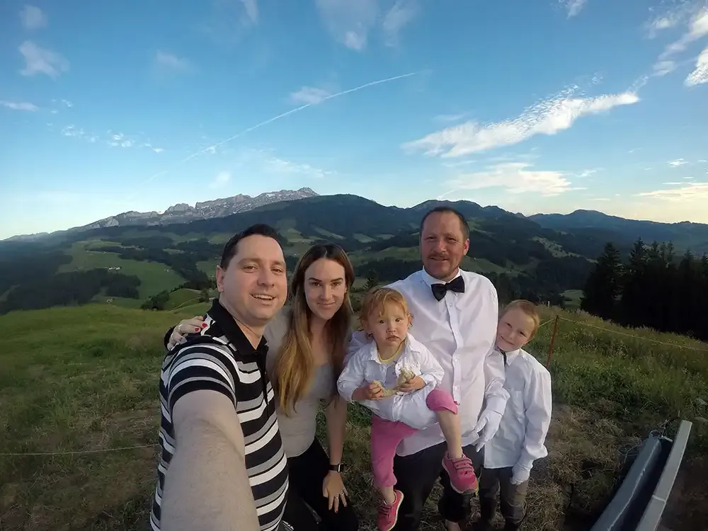 Roger Hohl and his family at the Null Stern Hotel with the Alpstein behind