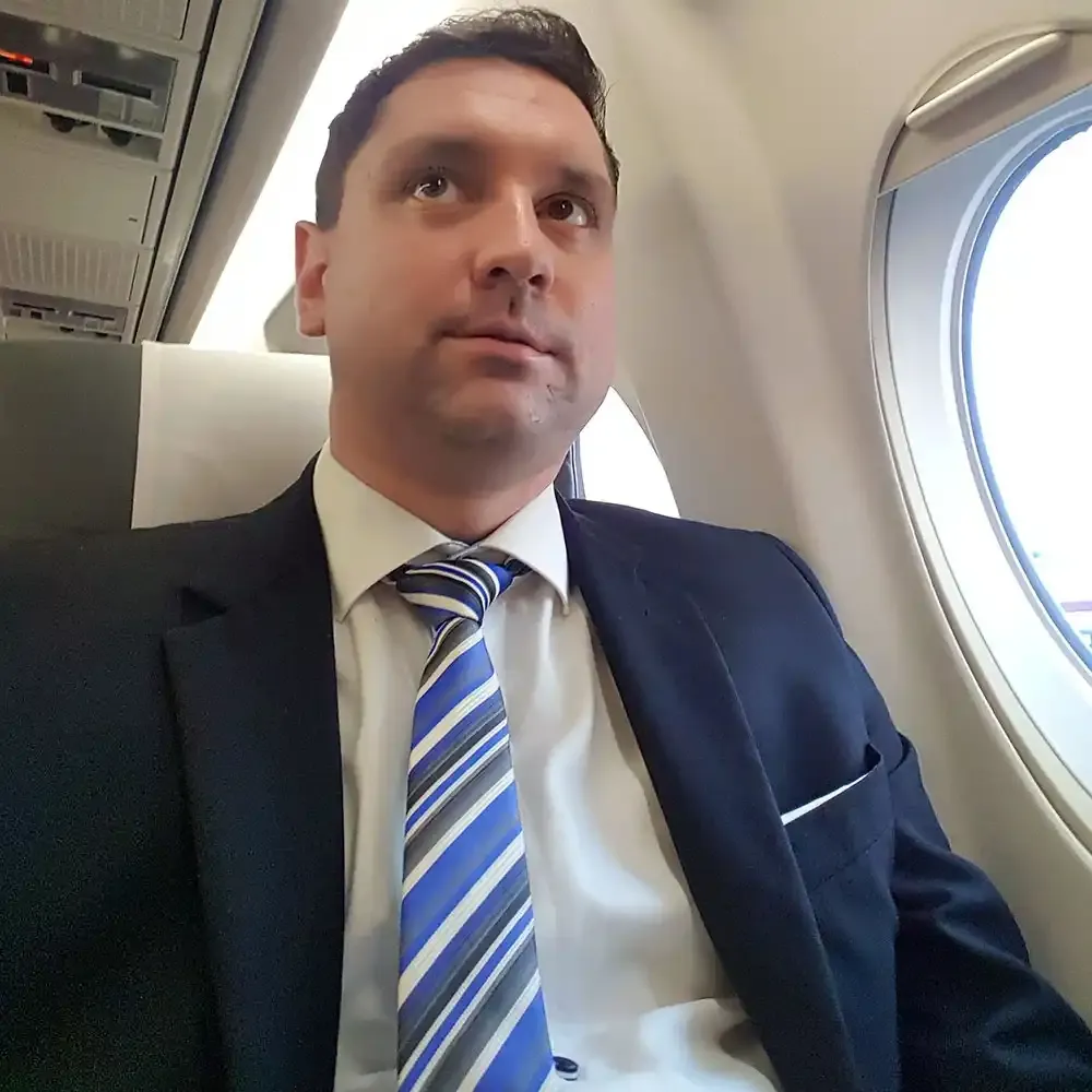 Roger Hohl in seat 1A of the Helvetic Fokker 100