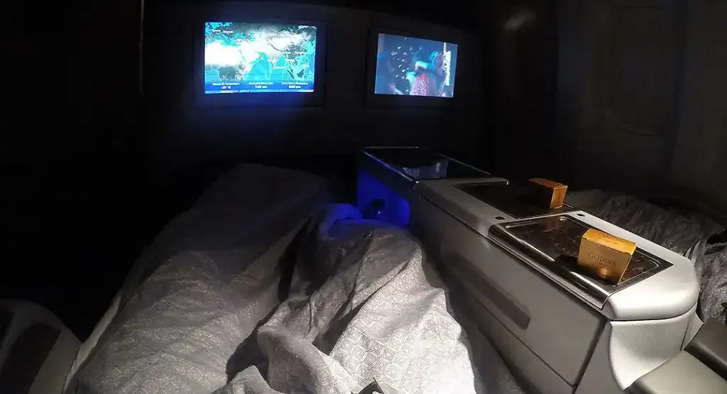 Qatar Airways Business Class seat made up as a flat bed