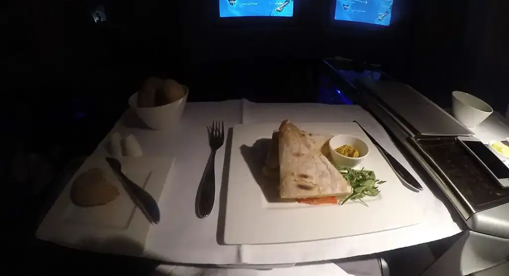 Wrap served on a white tablecloth in Qatar Airways Business Class