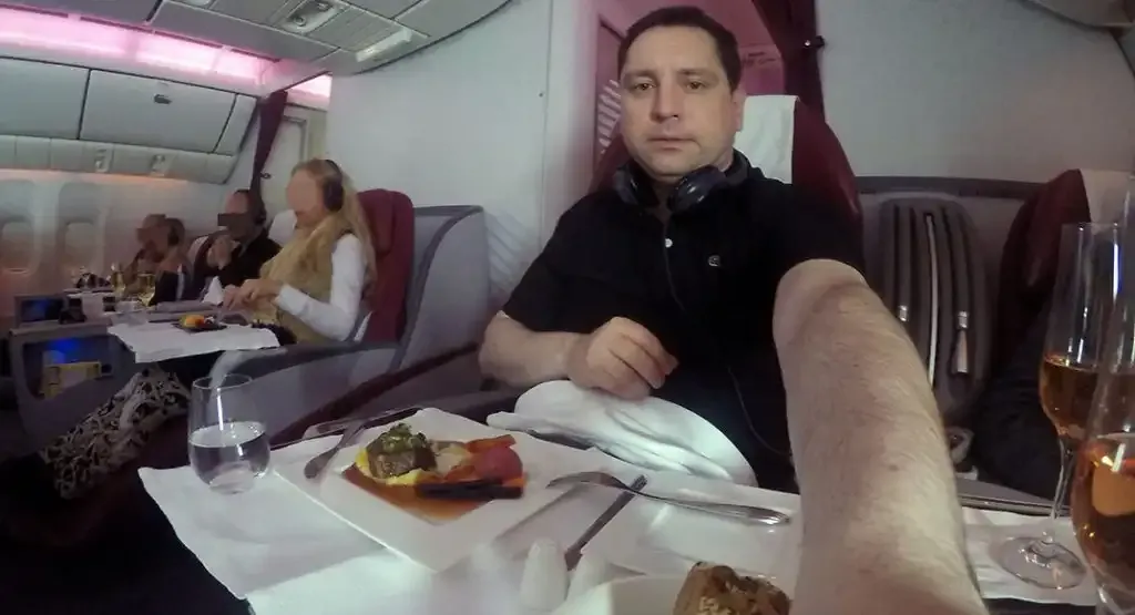Roger Hohl at his Qatar Airways Business Class seat during the meal service