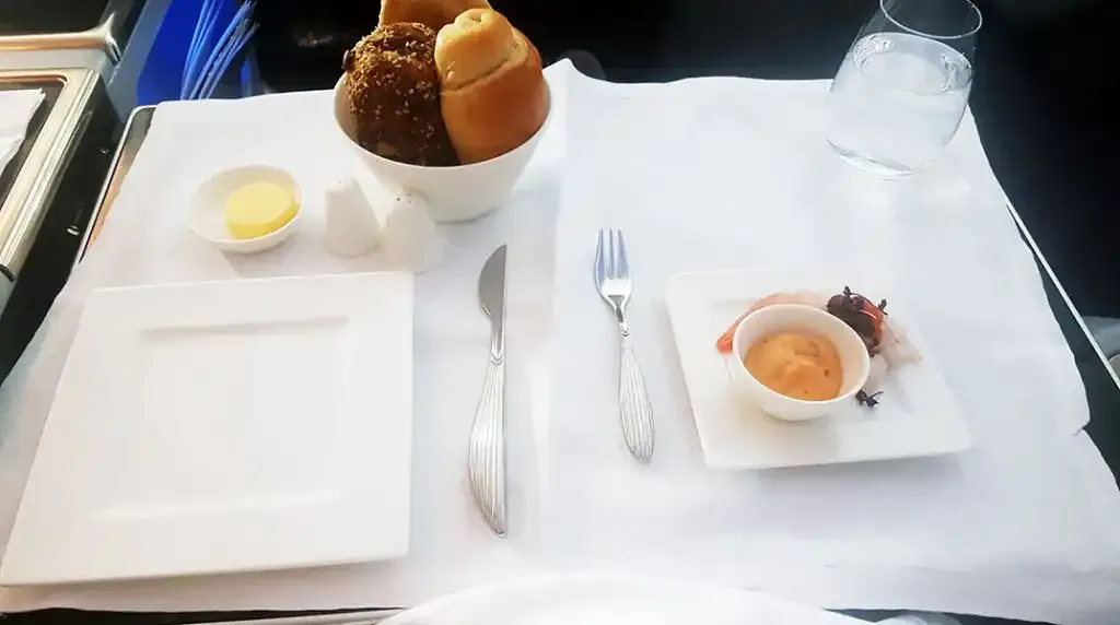Bread basket and table setting in Qatar Airways Business Class