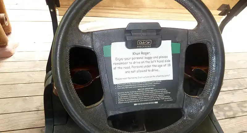 Instructions on the steering wheel of the Soneva Kiri buggy