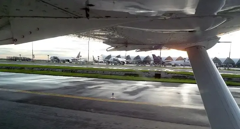 Airstrip seen from beneath the aircraft wing