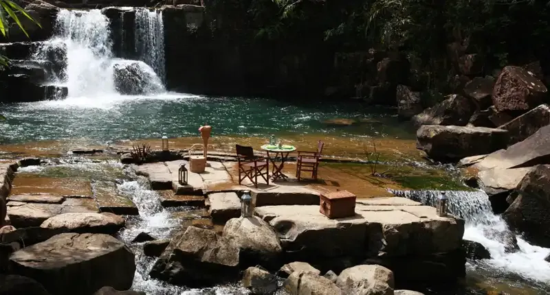Dining by the waterfall at Soneva Kiri