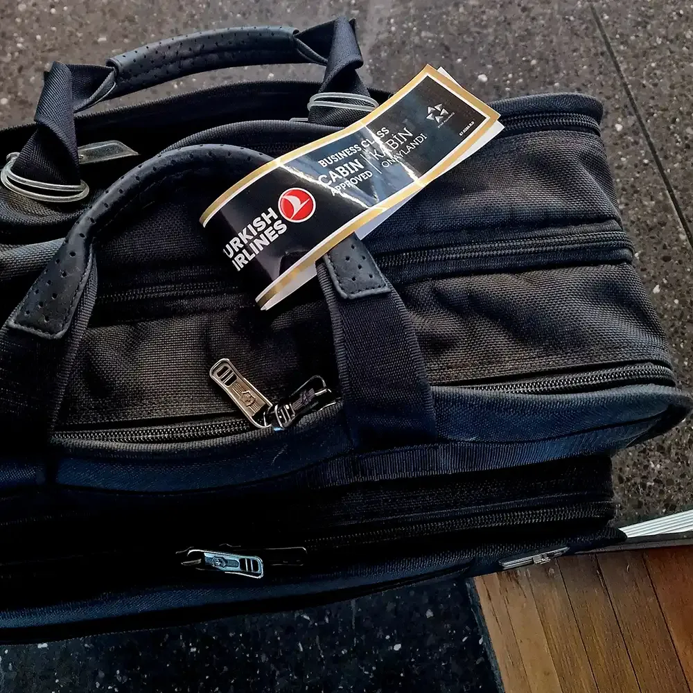 Hand luggage with a Turkish Airlines Business Class tag