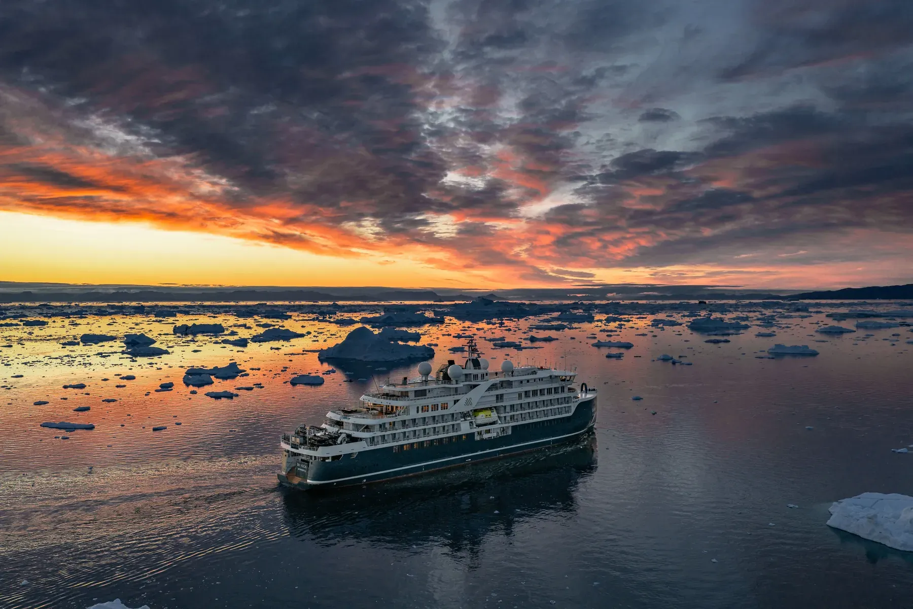 Swan Hellenic's SH Vega at sunset among icebergs